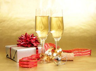 Champagne glasses on golden background