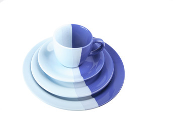 Set of multi-colored tea-things on a white background