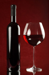 Bottle of red wine and wineglass