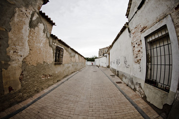 Fototapeta na wymiar Street with houses made of mud, rural town