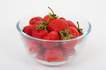 strawberries in the bowl closeup on white background