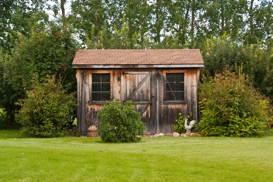 A charming, rustic garden shed made from reclaimed timber