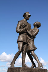 Poland - statue in Grudziadz, soldier dancing with a girl