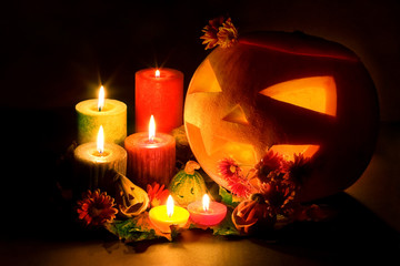 Halloween pumpkin and candles, still life.