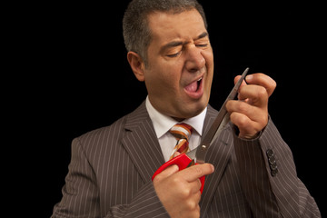 Businessman cutting nails