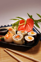 Sushi on a black platter