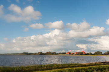 Fototapeta na wymiar Dutch landscape with water and farmhouse