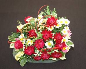 A Red Chrysanthemum and Daisy Flower Arrangement.