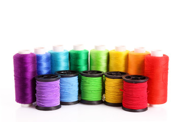 Coloured bobbins of thread isolated on white