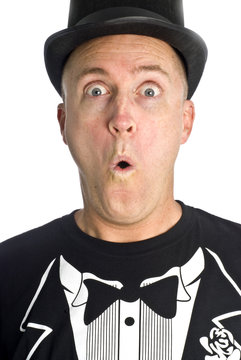 Man with Black Hat and T-Shirt Looks Surprised