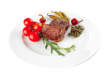 roast meat medallion with cherry tomatoes