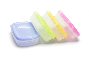 Four plastic storage containers