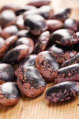 color beans on wooden table