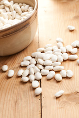 white beans on wooden table