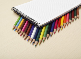 Fototapeta premium spiral notepad with set of color pencils