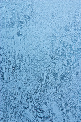 Fototapeta na wymiar frost pattern on window glass - abstract winter background