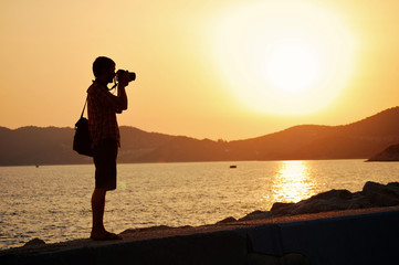 Photographing a sunset in the summer.