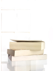 Softback books on table
