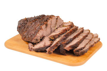 Roast beef on a wooden board