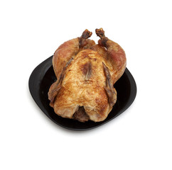 Tasty Crispy Roast Chicken on black plate .