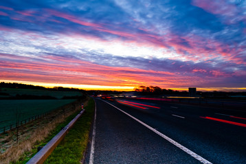 View from side of motorway with beautiful evening sunset