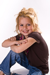 Cute little girl with her arms crossed