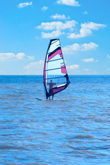 The man who is engaged in windsurfing