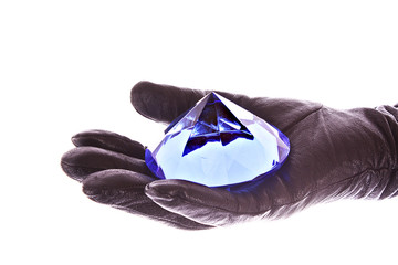 Hain in glove with blue diamond isolated on white