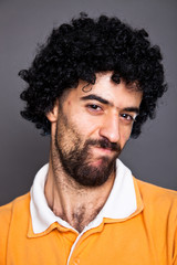 Young Man with Wig Making a Face