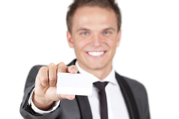 Businessman showing a white card against a white background