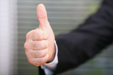 Mature business man with thumbs up
