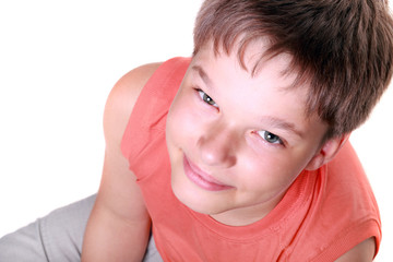 Photo of smiling young boy looking at camera