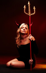 Beautiful devil with trident on black