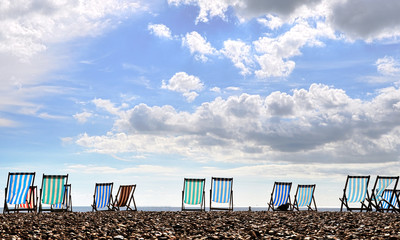 Deck chairs on Brighton beach, UK