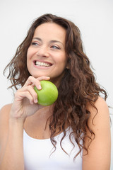 Closeup of woman eating a green apple