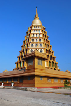 Large golden pagoda in blue background.