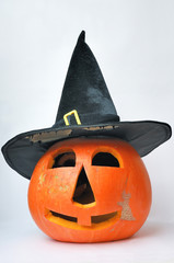 Halloween orange pumpkin with black hat