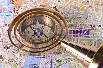 Bronze compass on a map