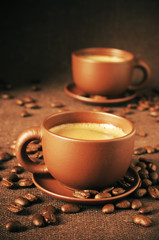 Cups of coffee and coffee beans