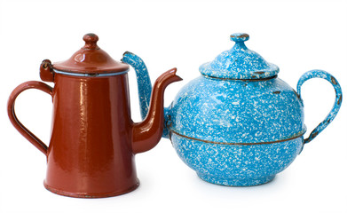 two enameled kettle, brown and blue, isolated on white