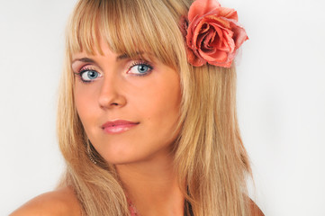 Fototapeta premium Portrait of the beautiful girl with blue eyes