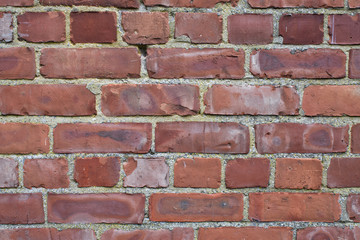 Old red brick wall medium sized bricks