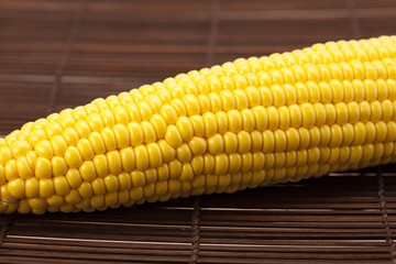 corn lying on a bamboo mat