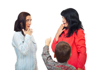 Little boy pointing to two women