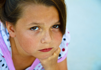 Beautiful young girl on a concrete patio.