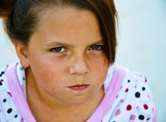 Beautiful young girl on a concrete patio.