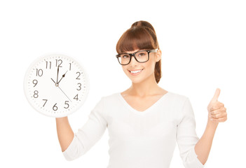woman holding big clock