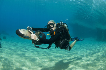 diver on underwater scooter
