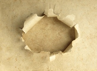 Fondo de papel viejo con agujero