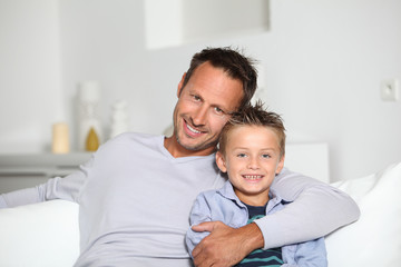 Fototapeta na wymiar Closeup of father and son at home